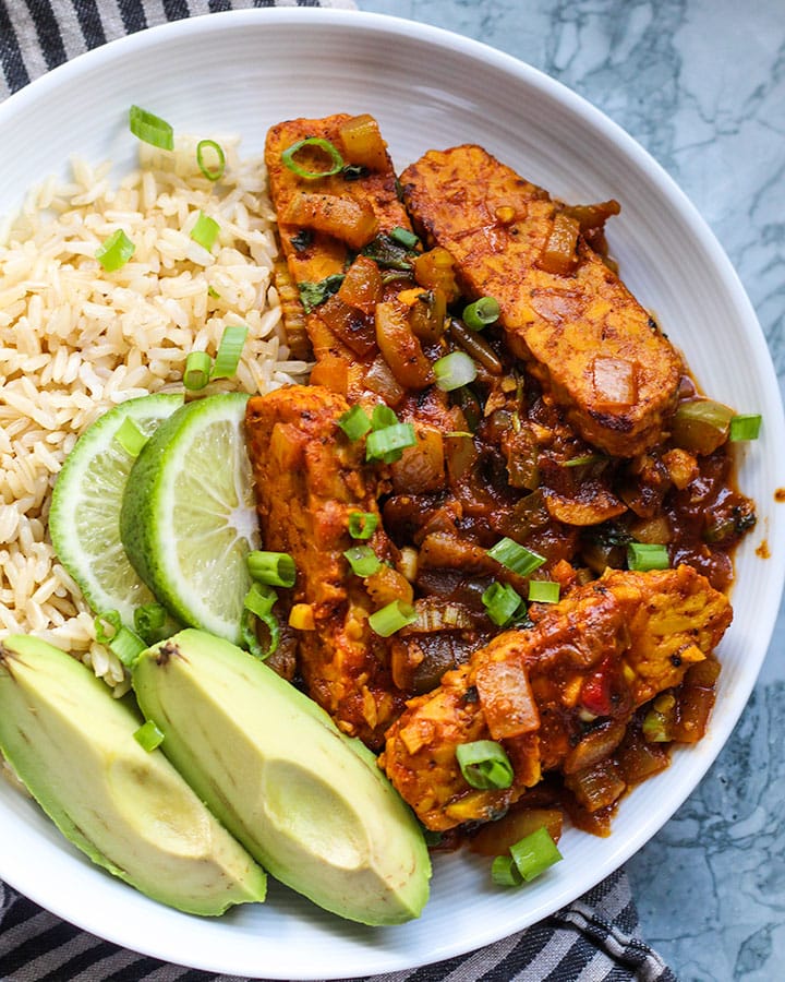 This vegan "pollo" guisado using tempeh, is a take on the classic Dominican stewed chicken I grew up. Still bursting with Latin spices and easy to make!