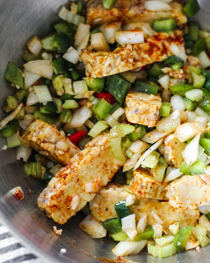 Vegan "pollo" guisado can be made by swapping typical chicken with tempeh and using the same classic latin spices and herbs!