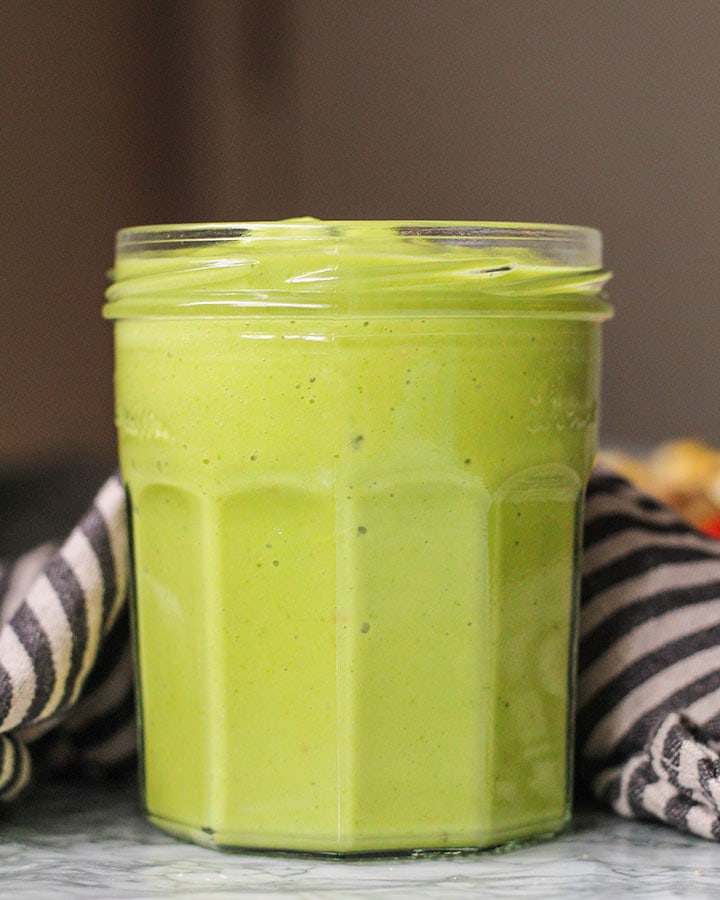 Jar of dressing ready to pour over salad.