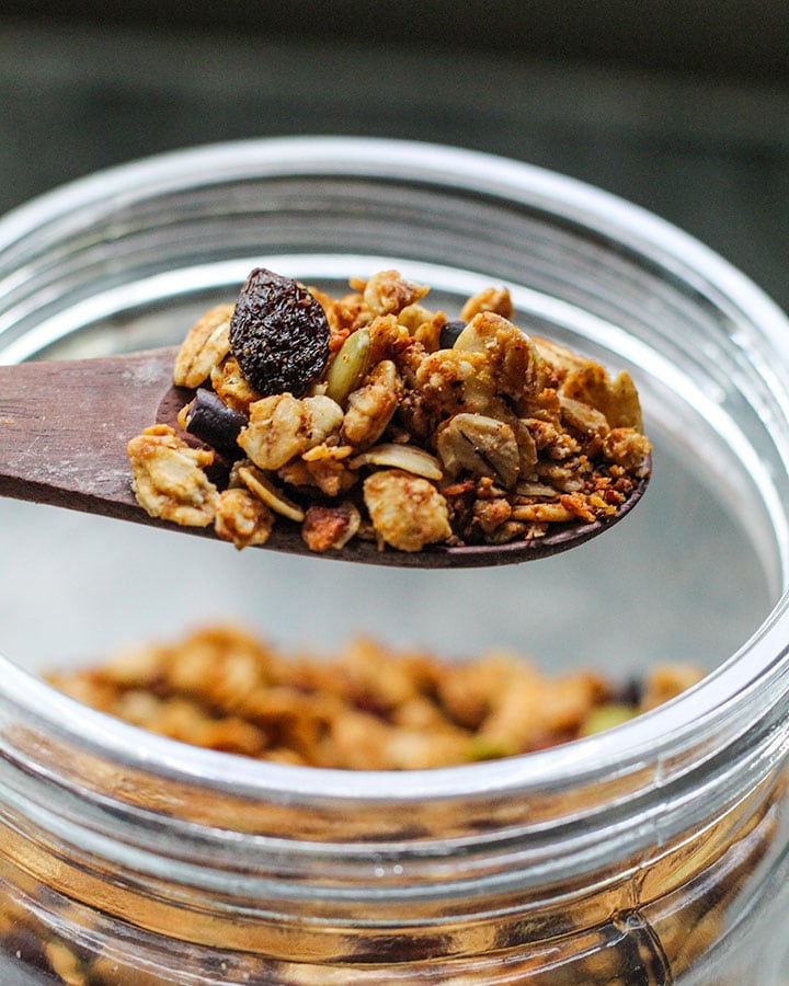 Spoon of granola pulled from batch of gronla.