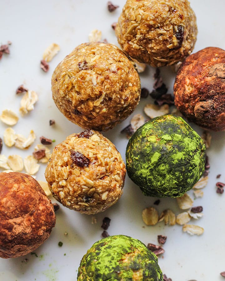 Energy bites arranged on a plate, close up.