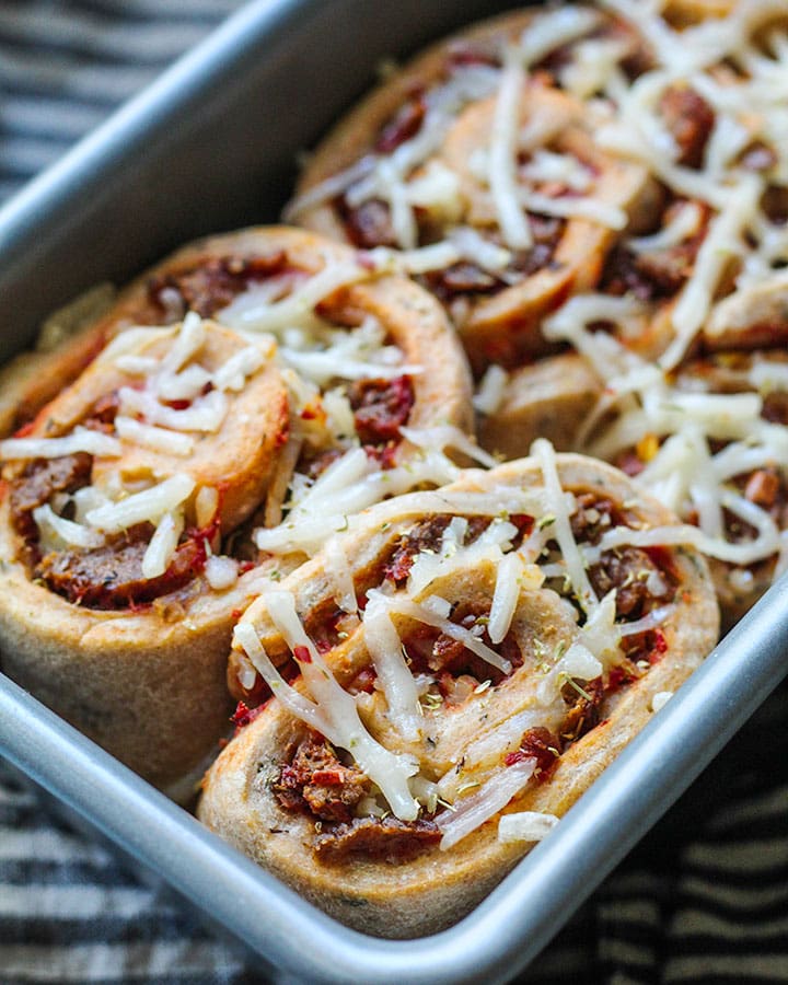 Vegan "Meatball" Pizza Rolls just out of the oven. Delicious and loaded with vegan cheese, vegan Gardein meatballs and the most delicious homemade sauce. Easy to put together and fun to eat. | plantbasedrdblog.com