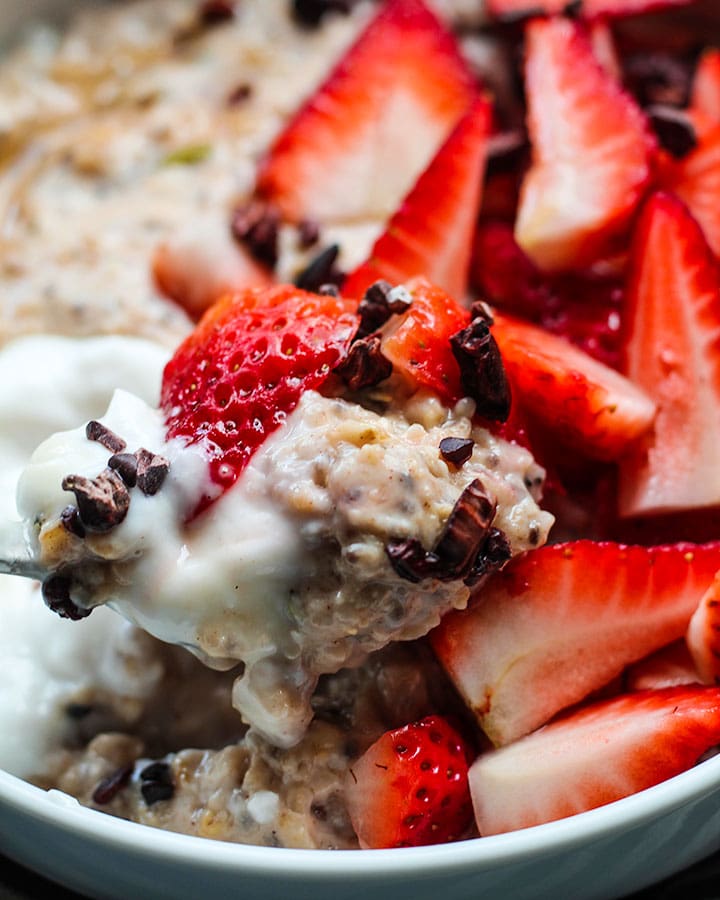 A bite of creamy high protein strawberry oatmeal.