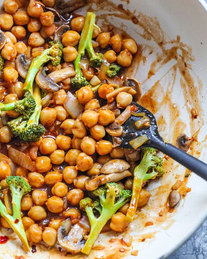 Pan with sweet and sour chickpeas stirred up and ready to serve.