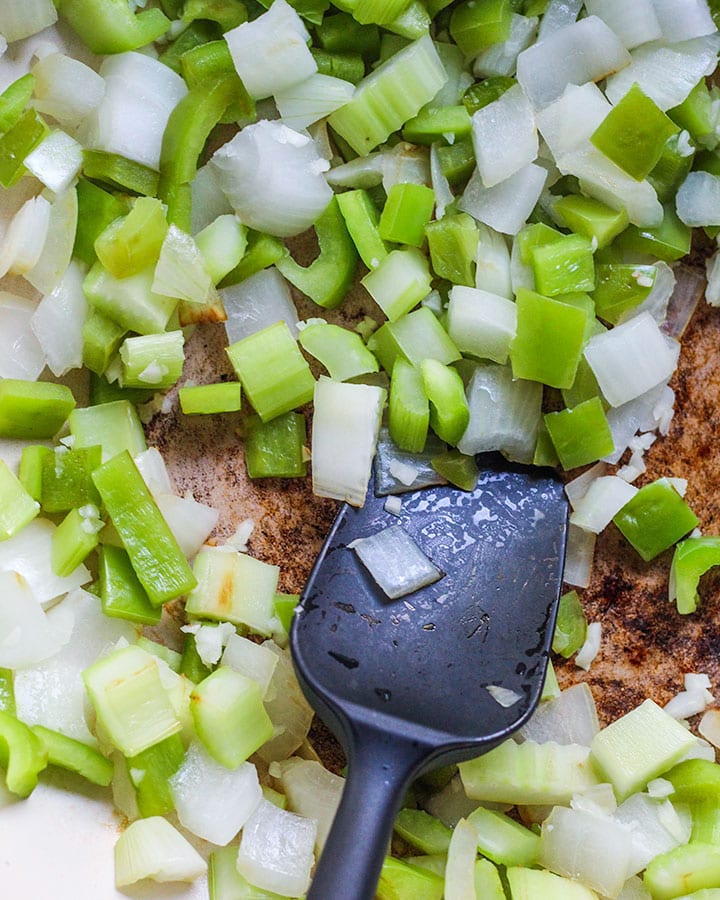 Pan with diced onions, green peppers, and celery.