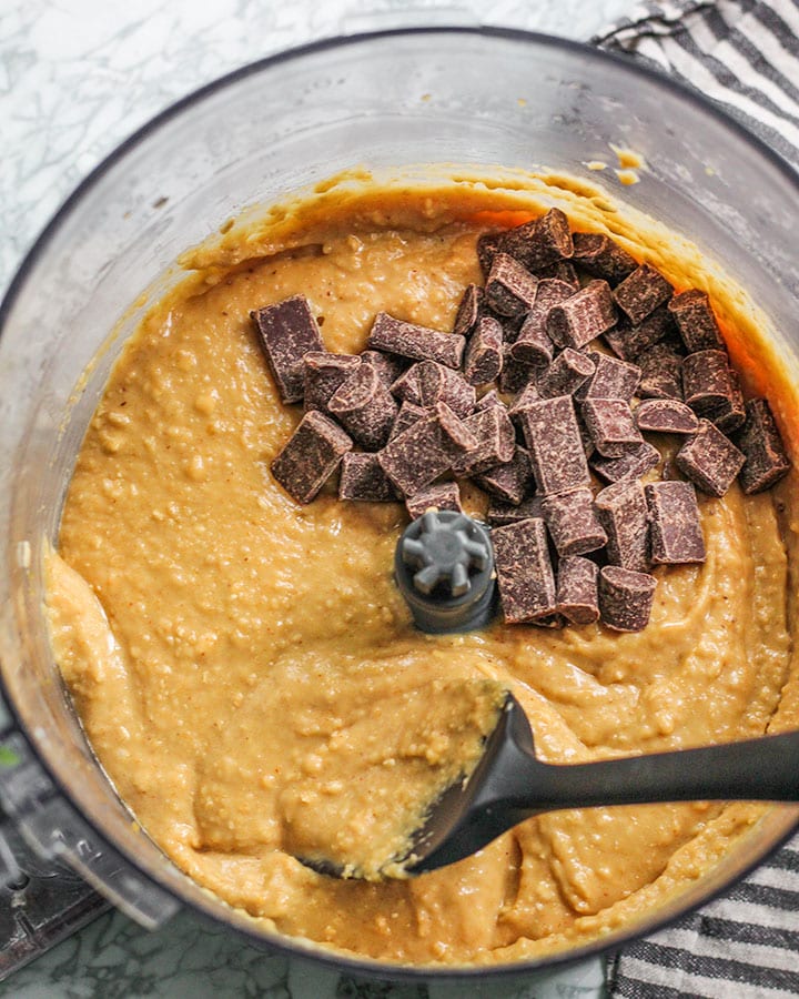 Chocolate chips being folded into the blondie batter.