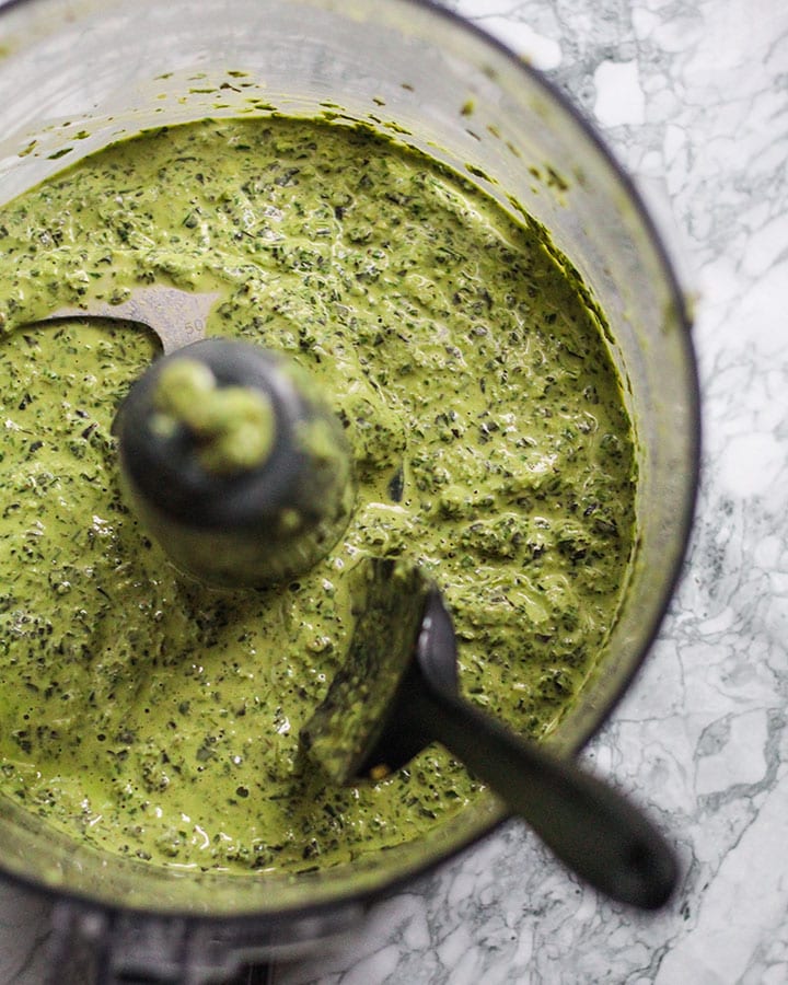 Pesto mixing up in food processor.