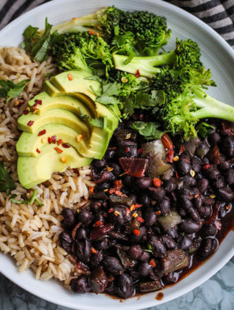 Black beans paired with brown rice, avocado, and steamed broccoli.