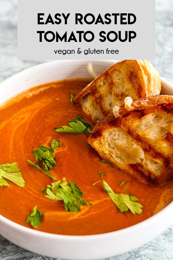 This easy vegan roasted tomato soup uses sun dried tomatoes and roasted garlic for a pop of flavor. Just bake and blend to perfection.