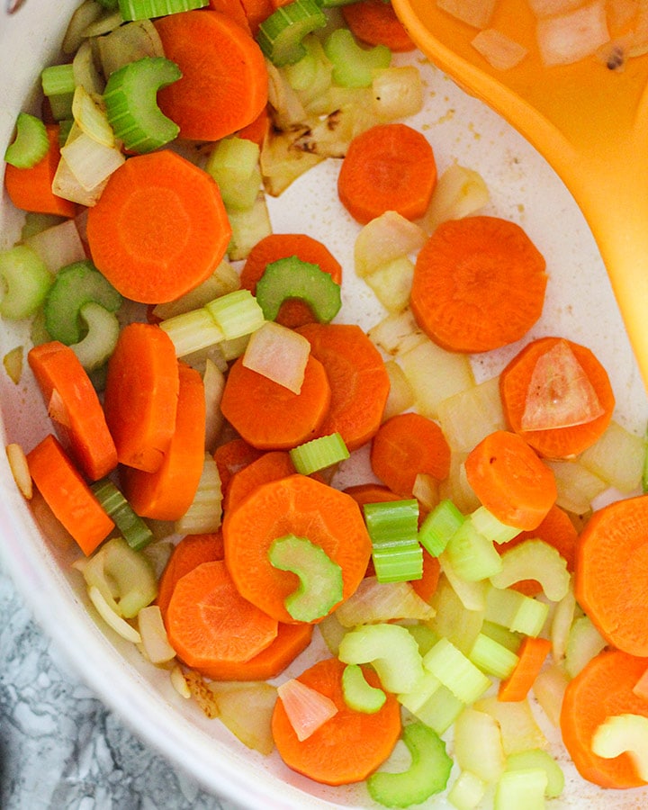 Sautéed carrots, celery, and onion in a large pot.