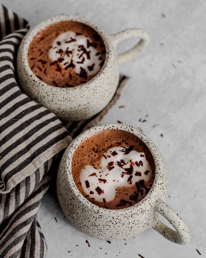 Mugs of hot chocolate just blended and perfectly frothy.