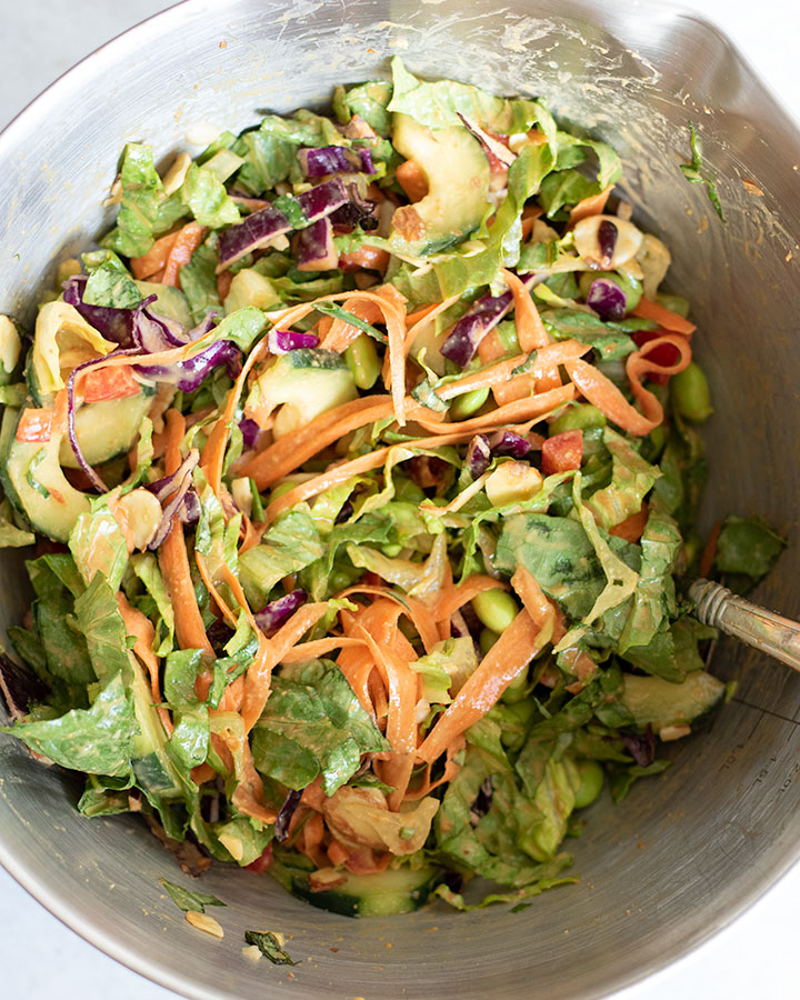 Mixing bowl of tossed edamame salad.