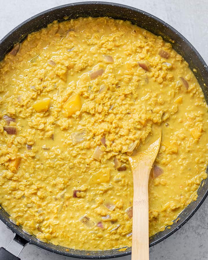 Pan filled with a creamy golden lentil curry.