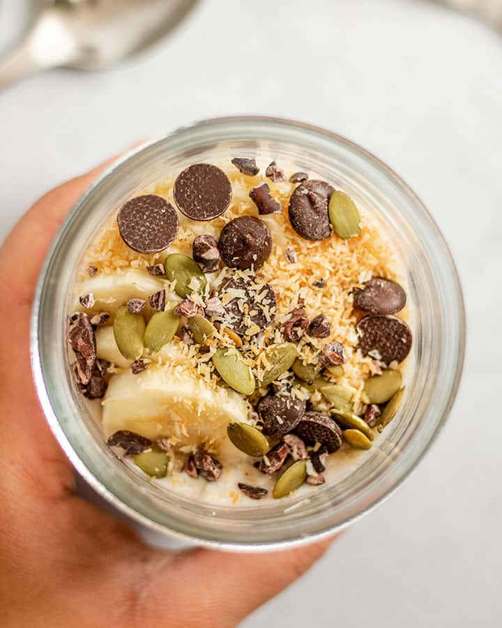 Holding one of the decorated oatmeal jars.