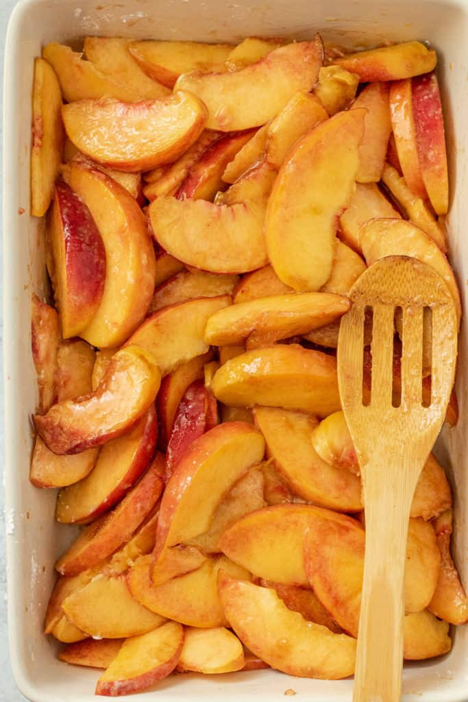 Peaches tossed with filling ingredients.