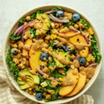 Salad bowl topped with sweet cashew mustard dressing.