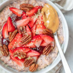Strawberry oats topped with strawberries and nut butter.