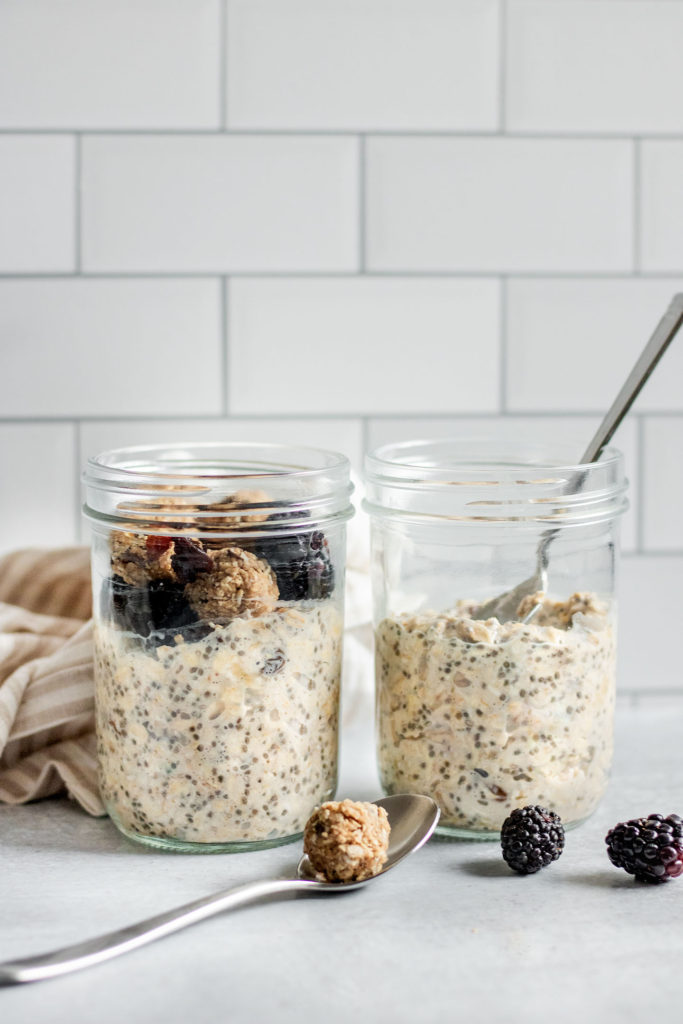 Jar of overnight oatmeal cookie dough with cookie dough bites in two jars with spoons.