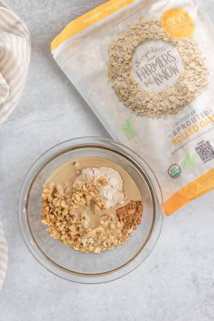 Crumble ingredients in a bowl with a bag of One Degree Organics Rolled Oats to the side.