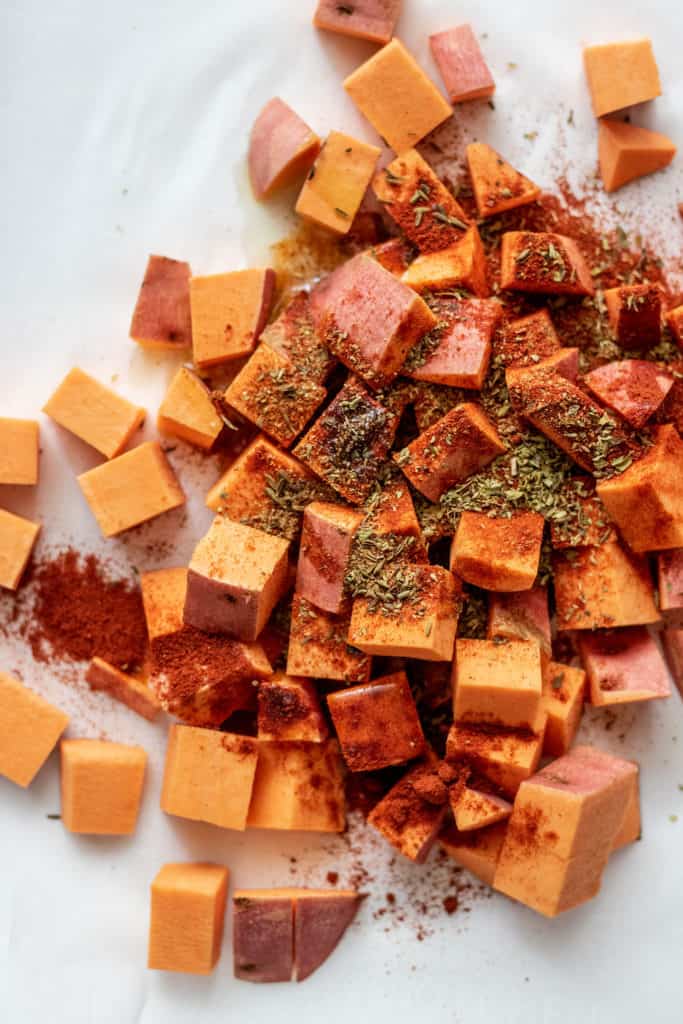Sweet potatoes topped with spices and herbs.