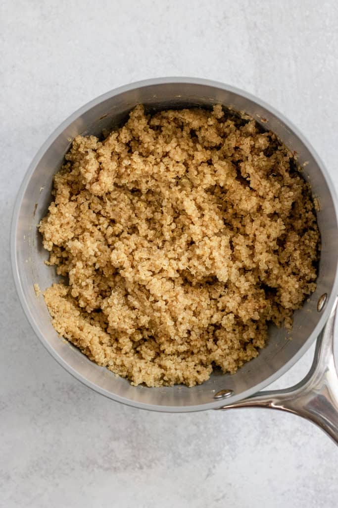 Quinoa cooked in a sauce pan.