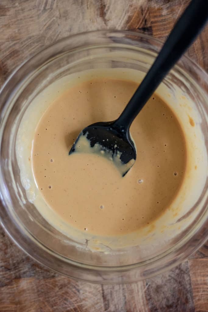 Bowl of perfectly smooth tahini dressing.