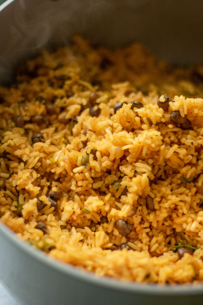 Large pot of cooked rice and pigeon peas.