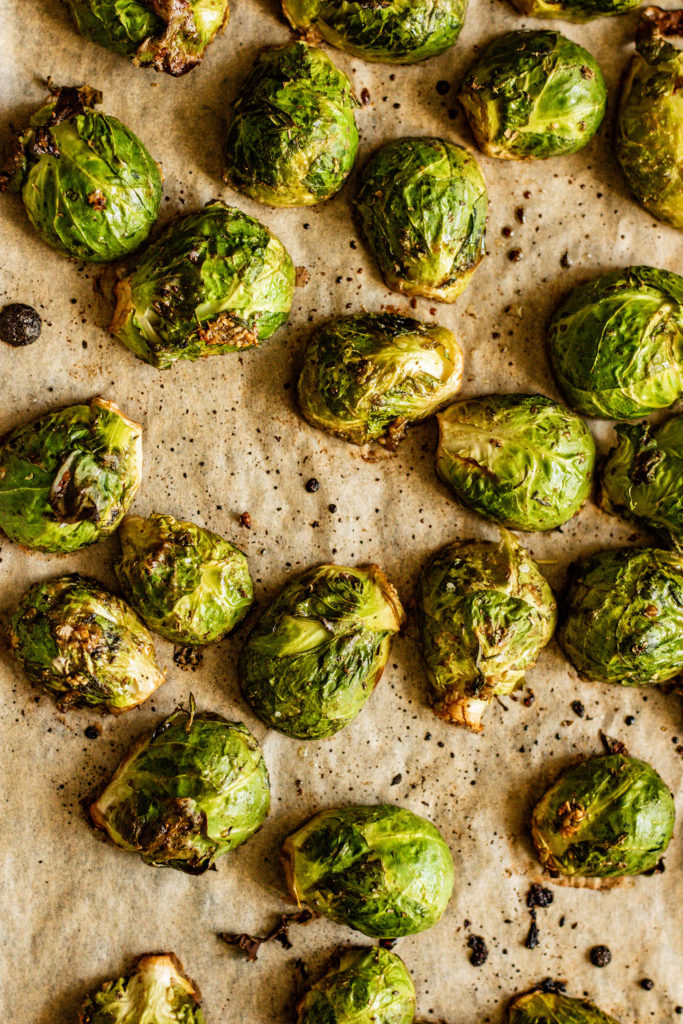 Freshly roasted brussels sprouts that have become golden in the oven.