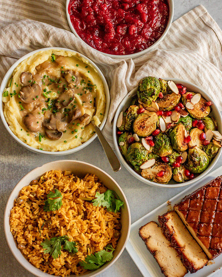 Top down view of 5 different vegan holiday recipes.