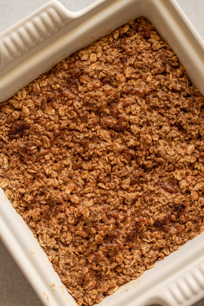 Baked oatmeal topped with brown sugar after baking in the oven.