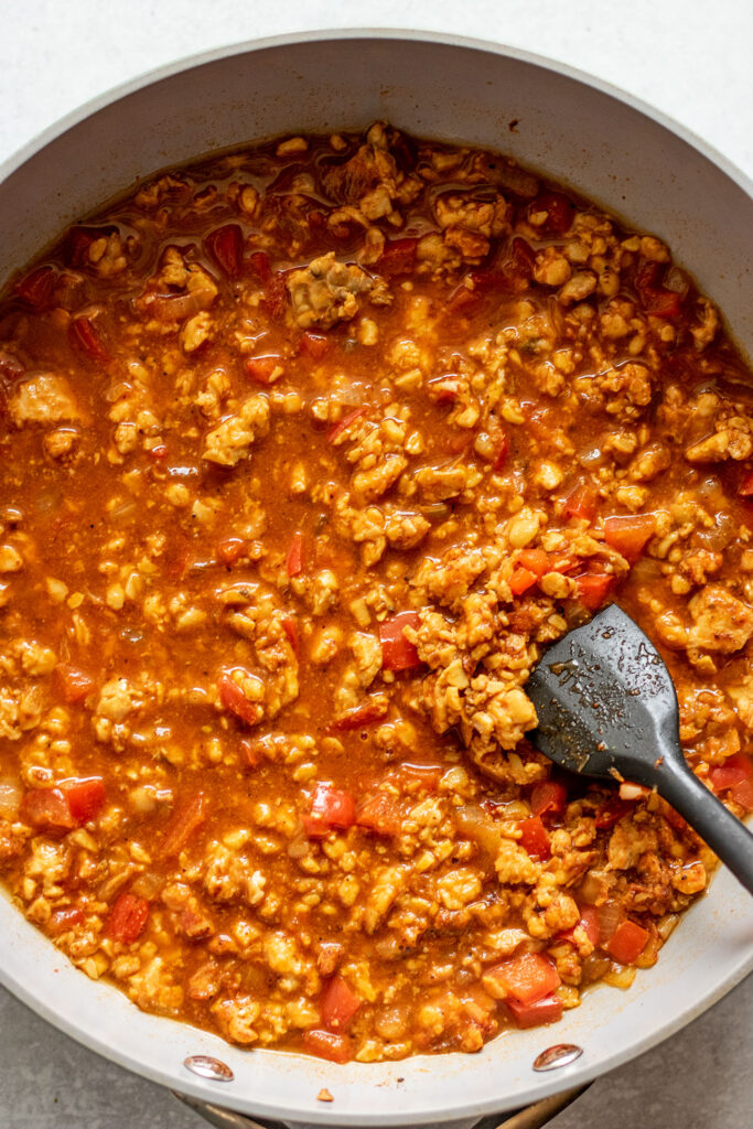 Tempeh simmering in broth and Dominican spices.