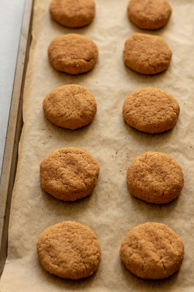 Baking tray loaded with fresh baked snickerdoodle cookies.