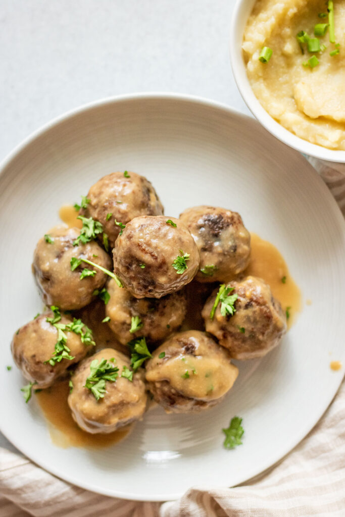 Top down view of Swedish meatballs with gravy.