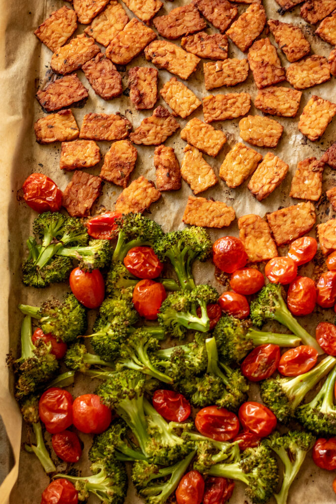 Fully roasted broccoli, cherry tomatoes and marinated tempeh.