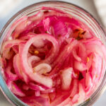 Vibrant pink colored Mexican Pickled Red Onions.
