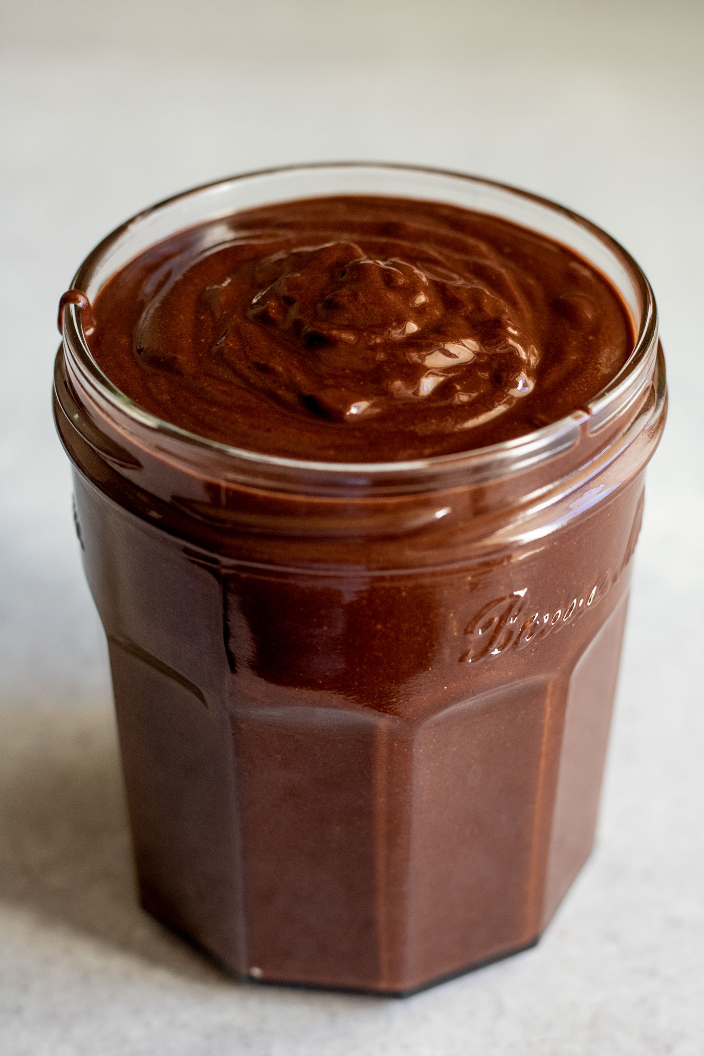 Homemade Nutella poured into a jar for storage.