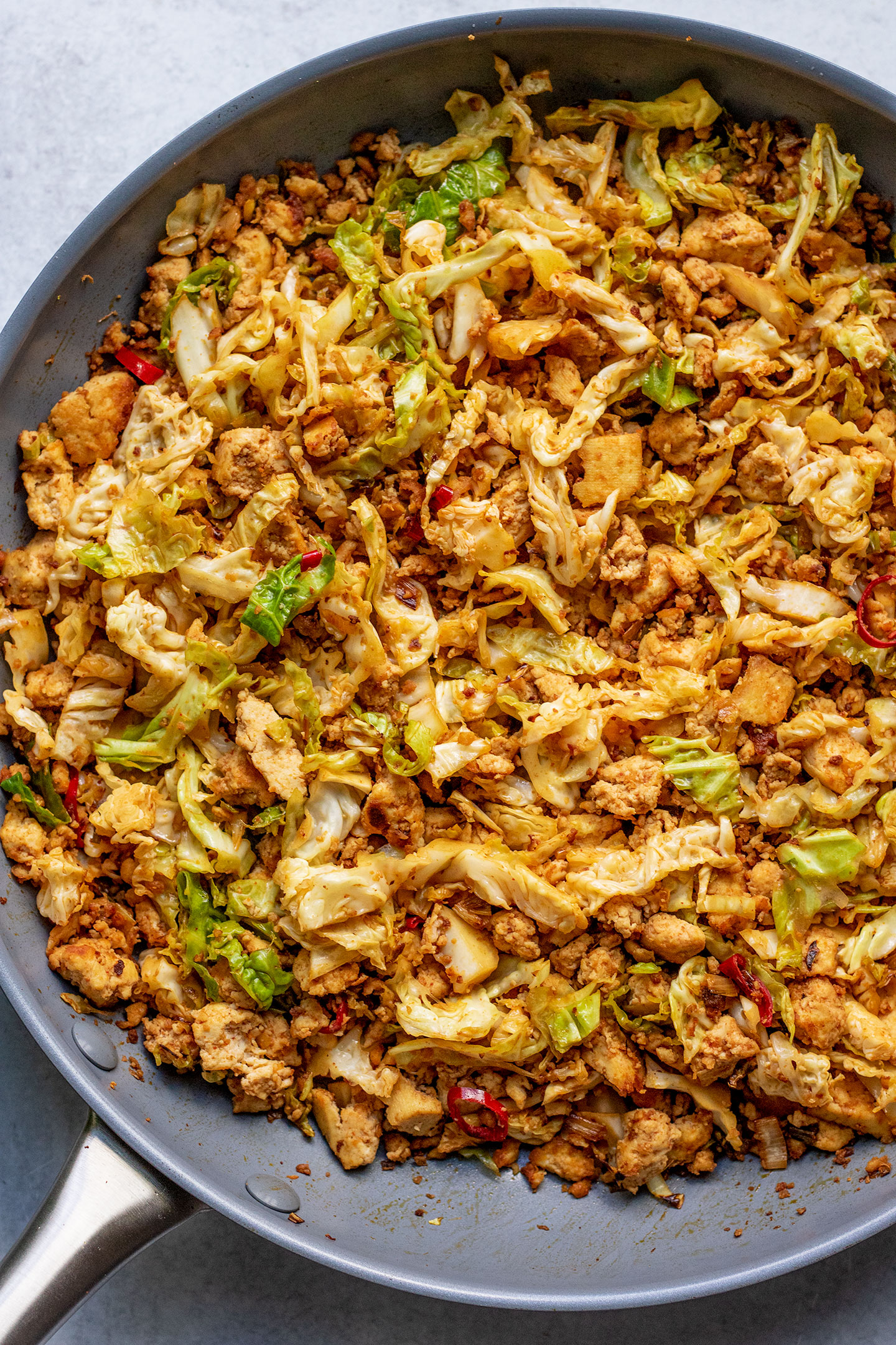 Sautéed cabbage and tofu in a large skillet.