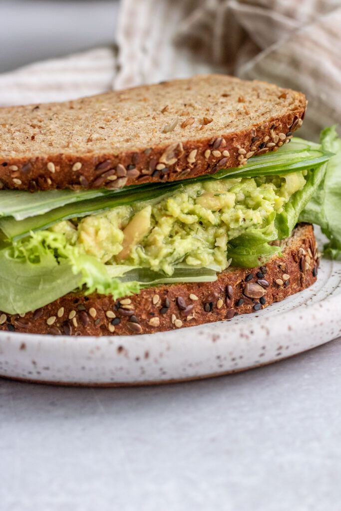 Avocado white bean sandwich fully assembled before cutting.