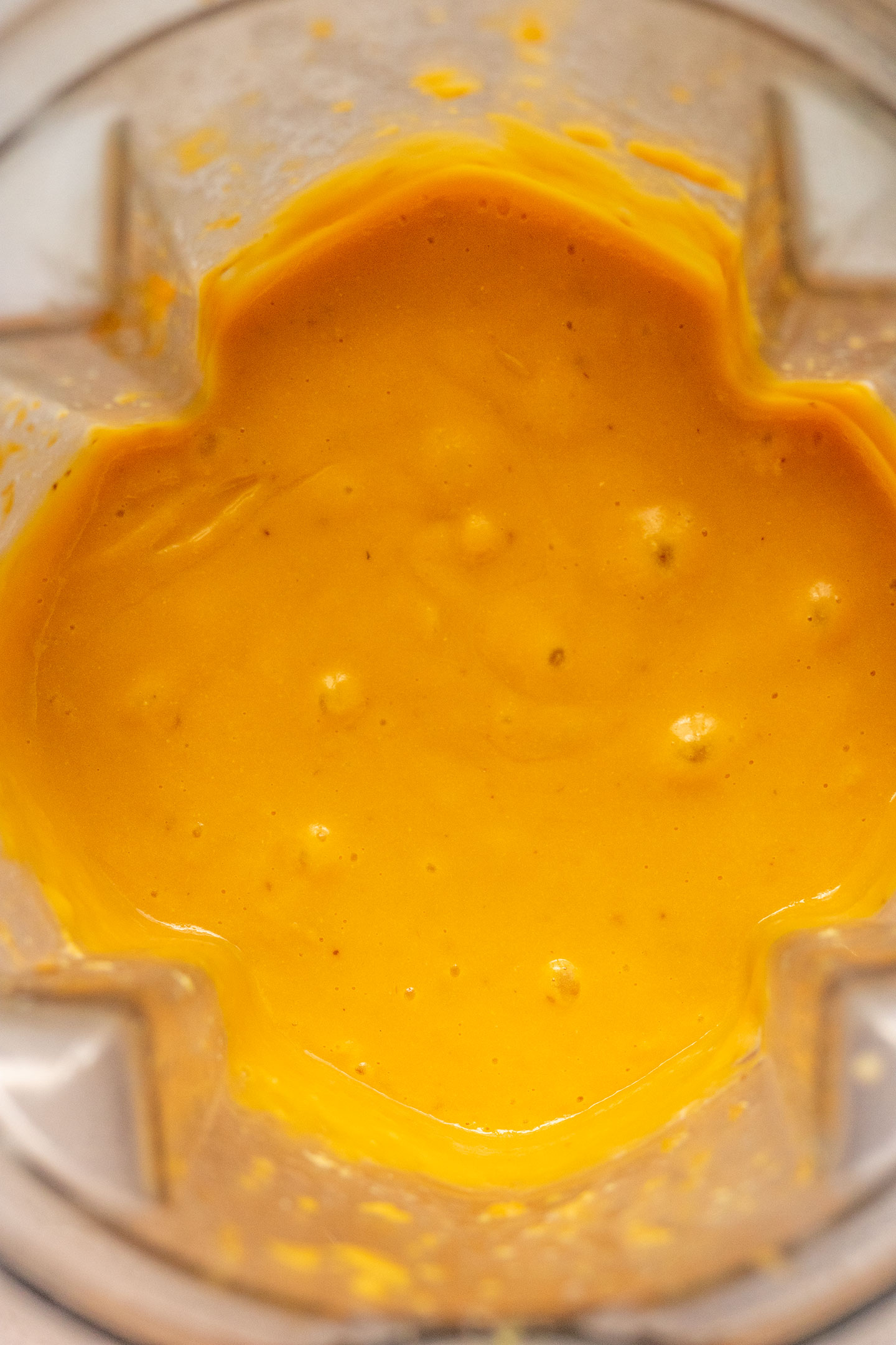 Butternut squash sauce blended until smooth in a blender cup.