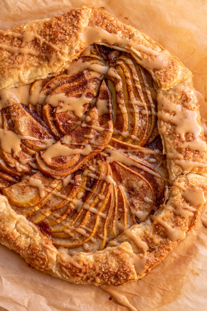 Puff pastry pear galette drizzled with a sweet peanut miso sauce.