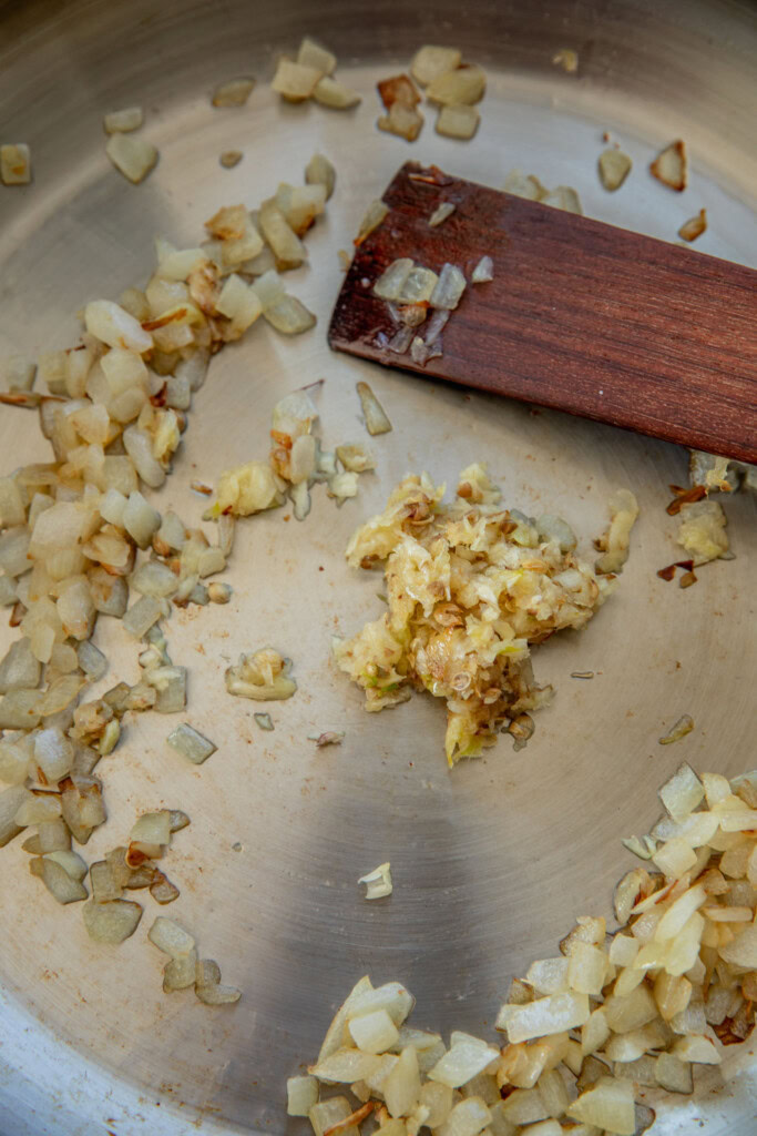 Sauteing the garlic into the onions.