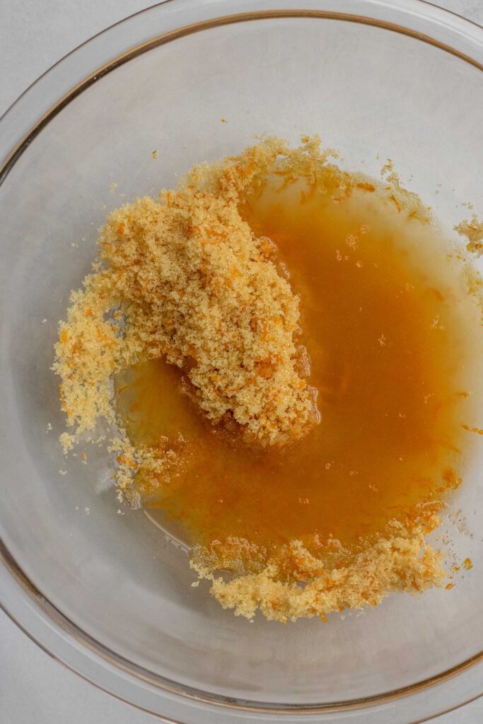 Mixing the orange and zest with aquafaba.
