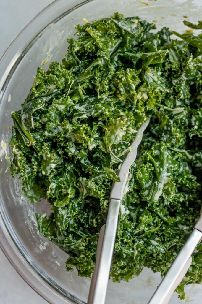 Kale tossed with a tahini Caesar dressing.