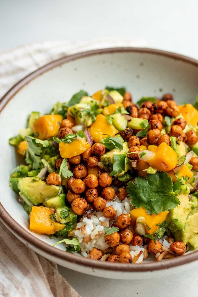 Mango salad served over protein rice and crispy chickpeas.