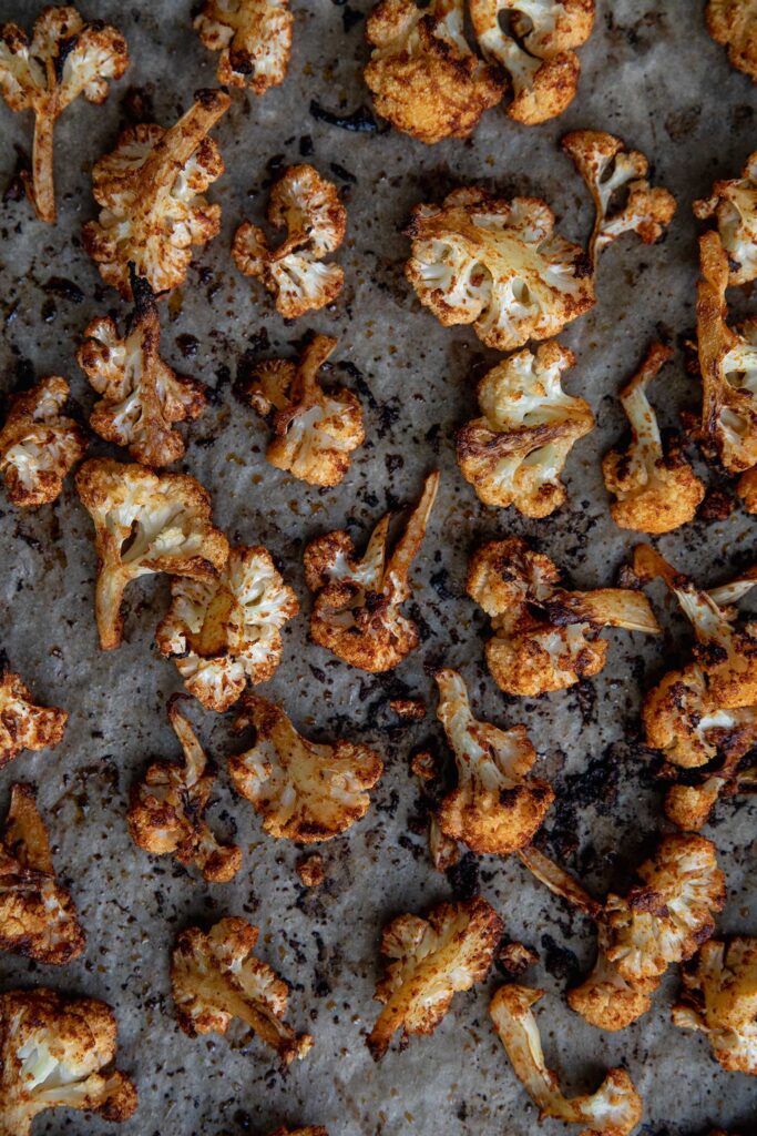 A sheet tray with roasted cauliflower.