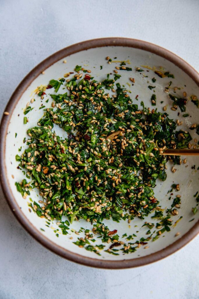 Sesame parsley herbs mixed together in a bowl.