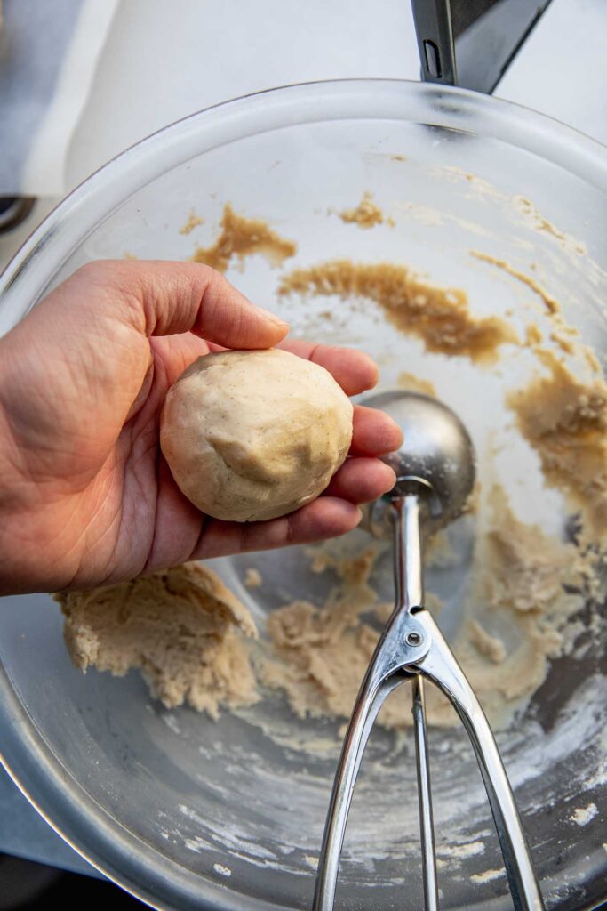 Scooping a dough ball into my hand.