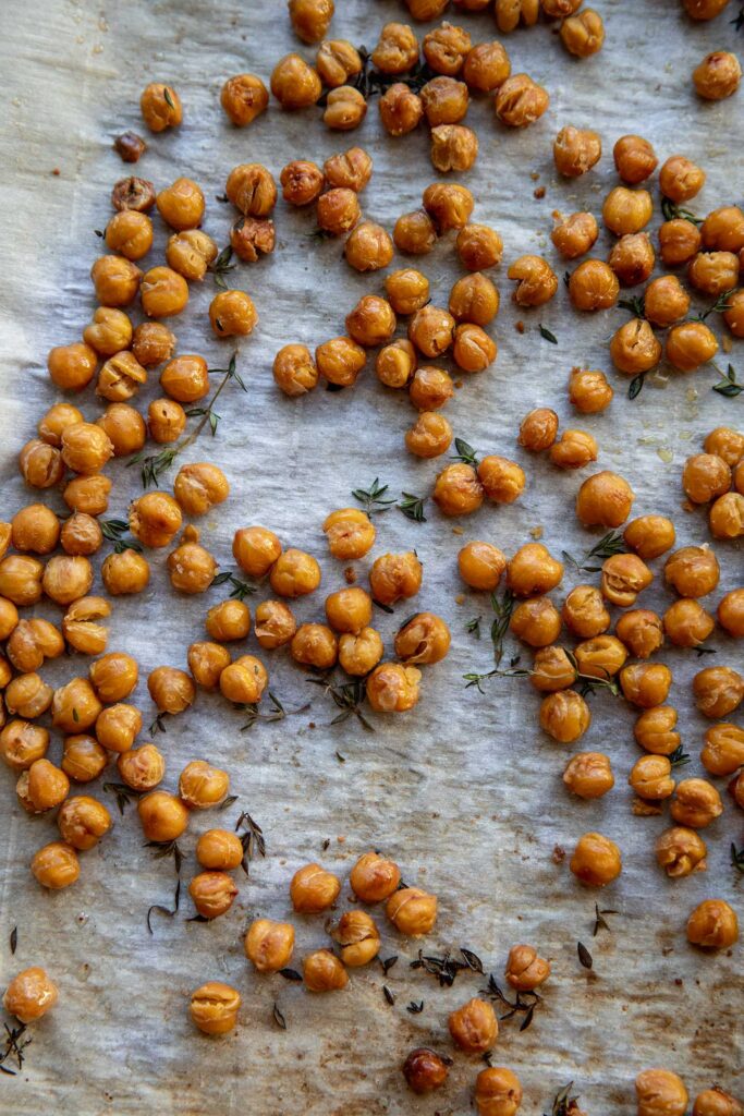 Roasted crispy chickpeas on a baking tray.