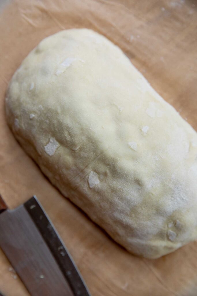 Folding the puff pastry over the filling.