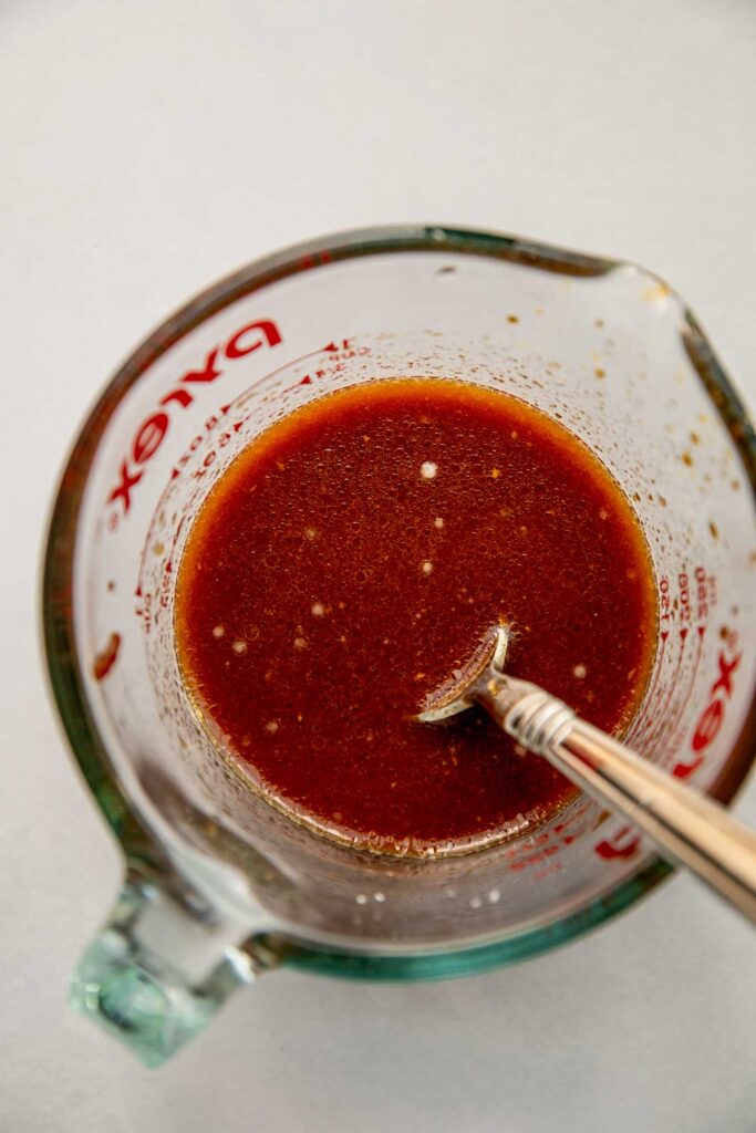 Stir-fry sauce in a glass measuring cup.